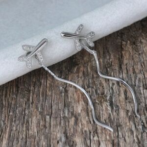 MODCLOTH FLYING AIRPLANE EARRINGS